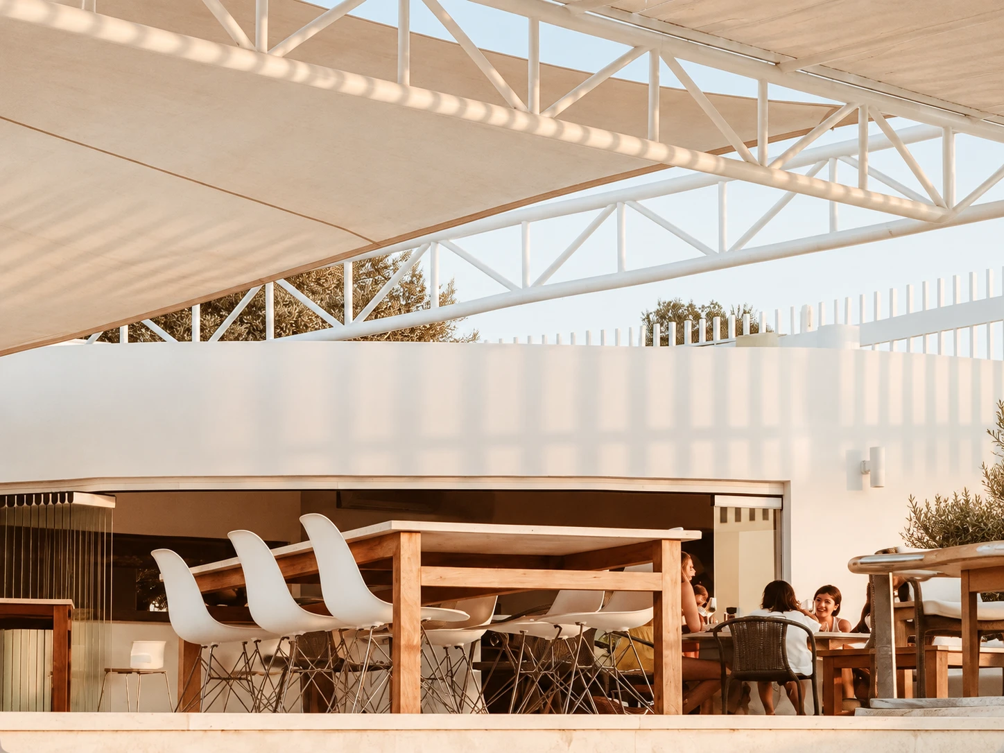 Terrace seating and white structural canopy at AGU Bar & Restaurant in Bodrum
